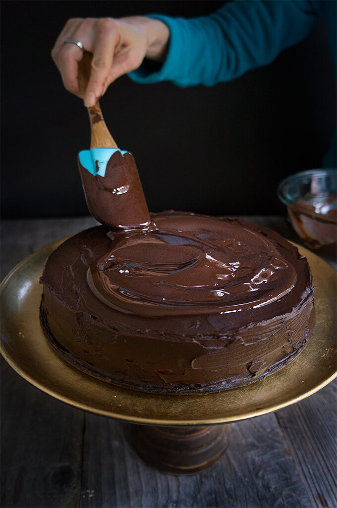 Garash cake - layers of walnut meringue and rich dark chocolate cream, enveloped in silky chocolate ganache - the ultimate chocolate lover's cake, perfect for that special occasion! | www.viktoriastable.com