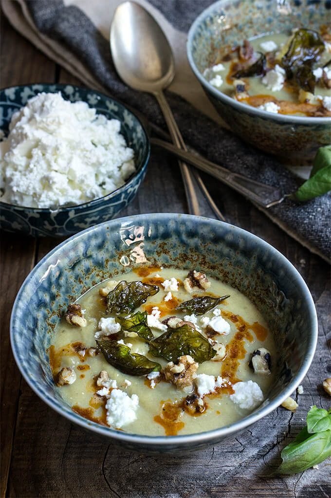 Cauliflower fennel soup - topped with crispy basil, feta cheese, toasted walnuts and paprika butter sauce. Delicious, and healthy, perfect for a cold winter day. | www.viktoriastable.com