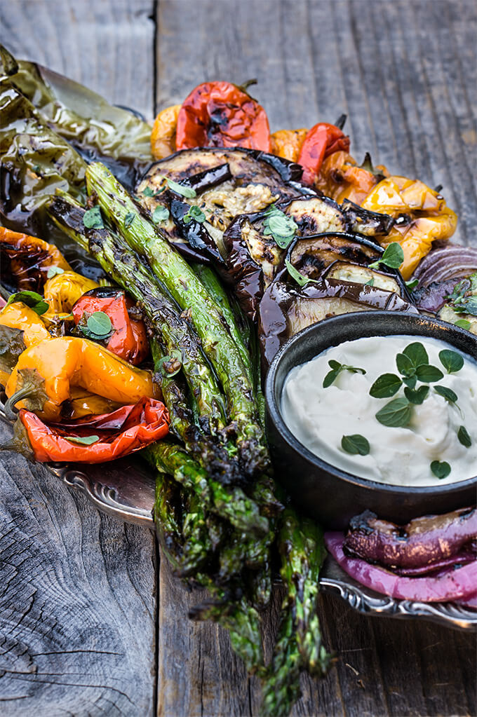 Marinated grilled vegetables with whipped goat cheese - eggplants, peppers, zucchini, asparagus, and onions, marinated and grilled till soft on the inside and charred on the outside, then doused in garlicky marinade, and served with whipped goat cheese on the side. | www.viktoriastable.com
