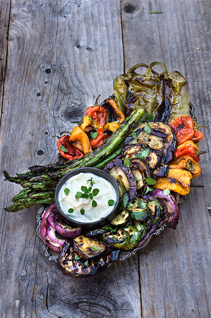 Marinated grilled vegetables with whipped goat cheese - eggplants, peppers, zucchini, asparagus, and onions, marinated and grilled till soft on the inside and charred on the outside, then doused in garlicky marinade, and served with whipped goat cheese on the side. | www.viktoriastable.com