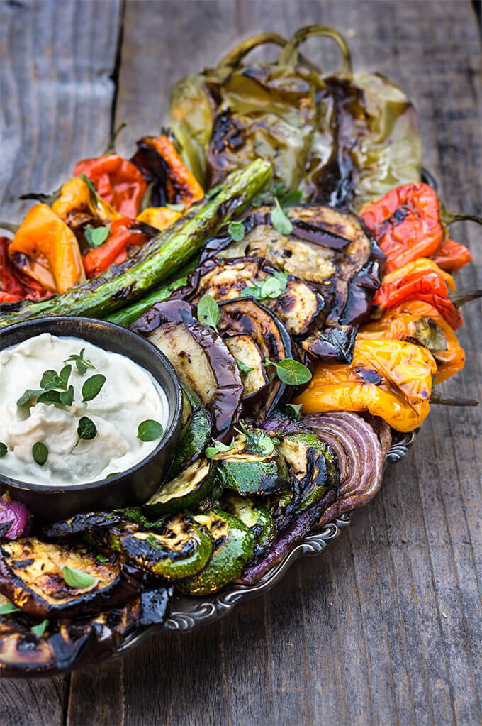 Marinated grilled vegetables with whipped goat cheese - eggplants, peppers, zucchini, asparagus, and onions, marinated and grilled till soft on the inside and charred on the outside, then doused in garlicky marinade, and served with whipped goat cheese on the side. | www.viktoriastable.com
