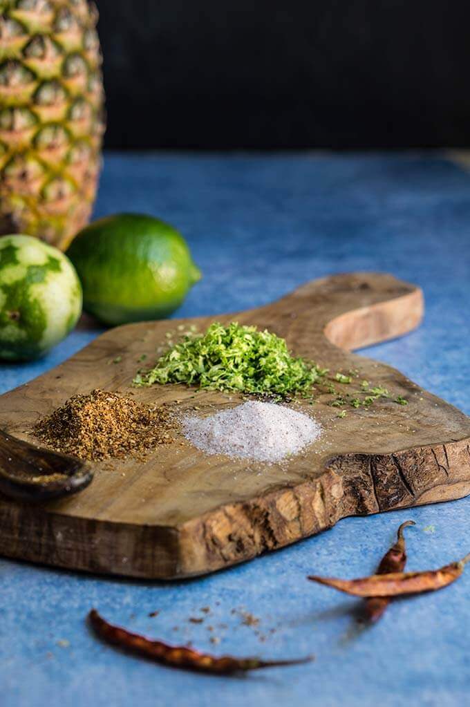 Spicy pineapple margarita - icy-cold, with a spicy kick, fruity and refreshing, served with fragrant chili lime salt, this drink will give you just the right amount of heat and freshness. | www.viktoriastable.com